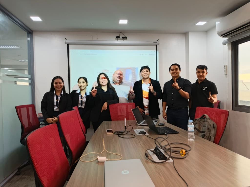 iGotSolutions team with clients after an on-site software demonstration in a meeting room in Cebu, Philippines